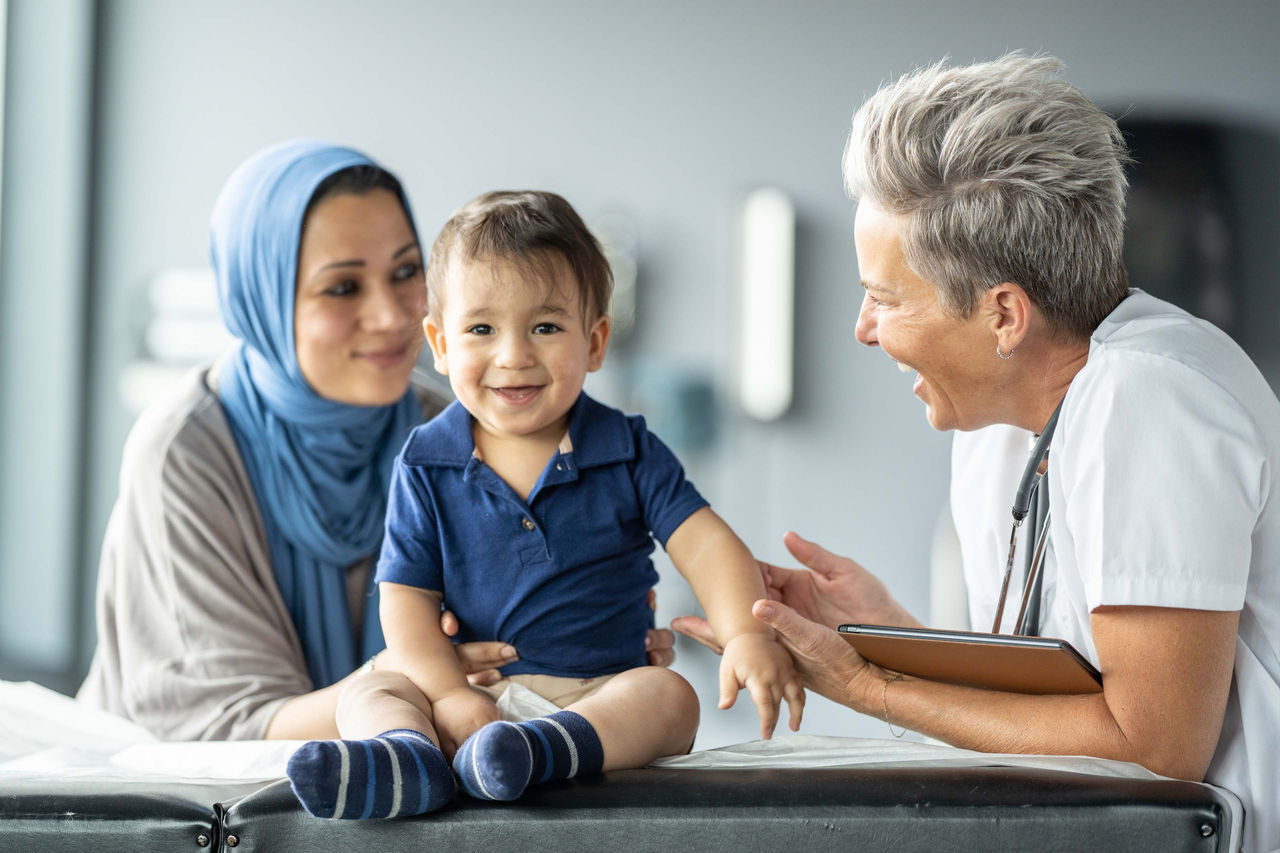 Doctor with mom and patient