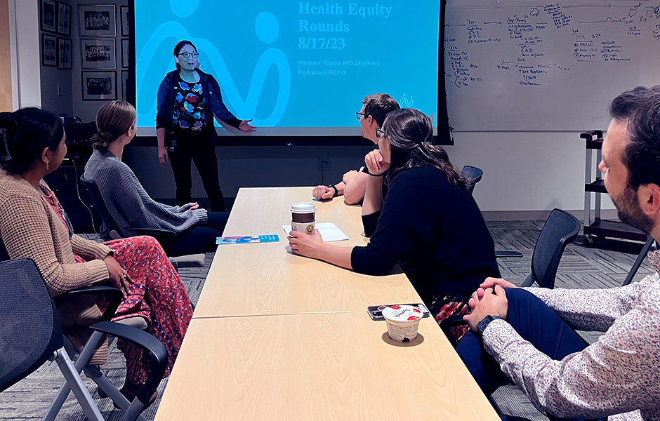 A group of students in class watching a presentation.
