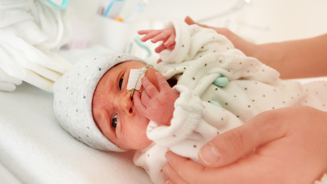 Newborn Baby Being Cared For On Changing Table