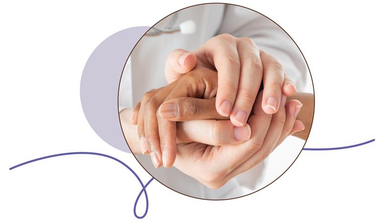 Close-up of supportive hands in healthcare setting